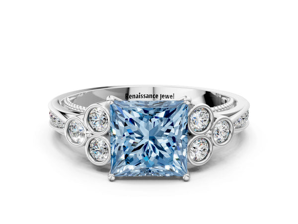 Platinum Fancy Blue Princess  Cut Diamond Engagement Ring with Bezel Set Round Side Stones and Prong Setting