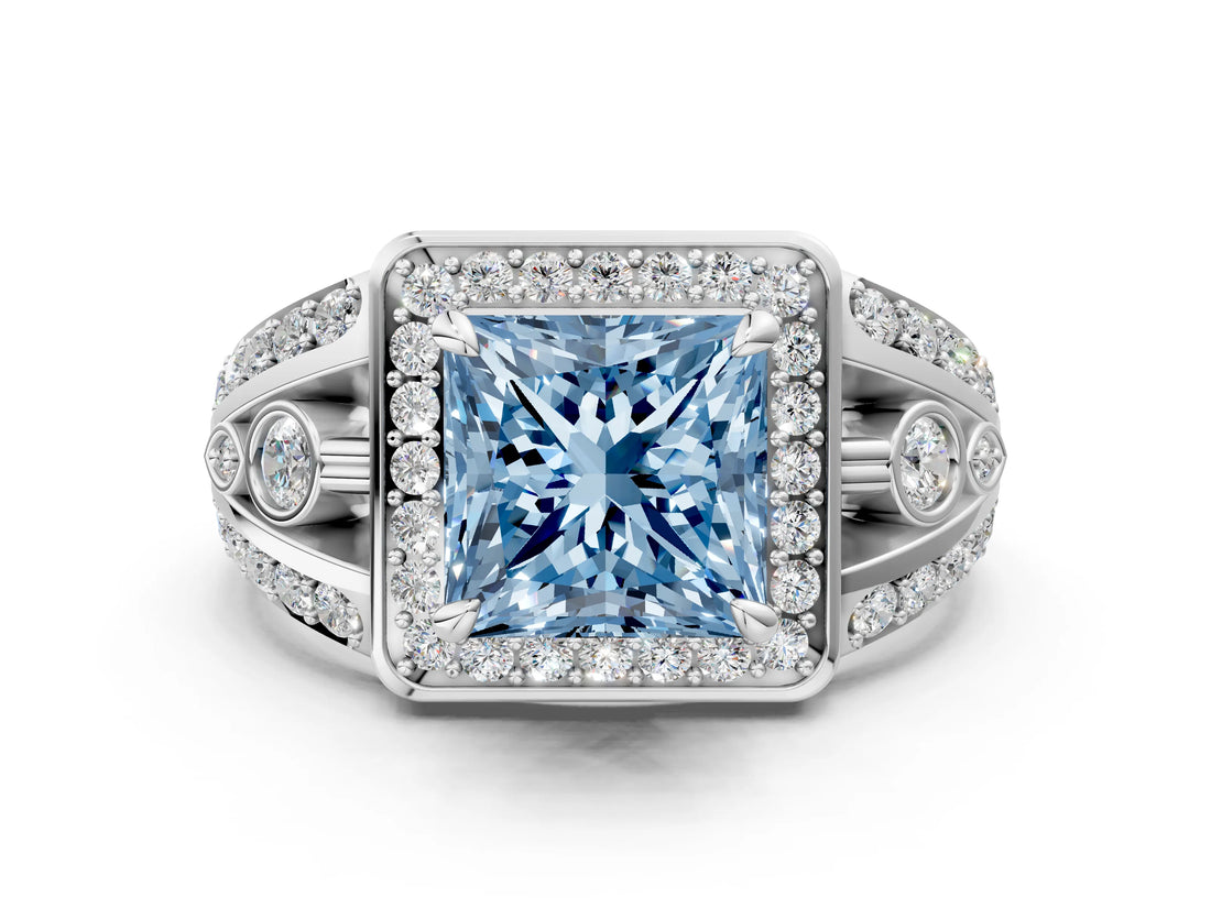 White gold Fancy Blue Princess Cut Diamond Halo Ring with Split Shank and Bezel Accents and Four-Prong Setting