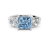 White gold Fancy Blue Princess Cut Diamond Three-Stone Ring with Prong Setting and Pavé Band