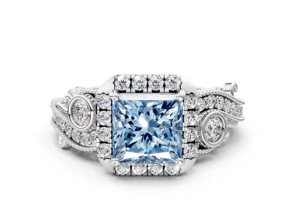 White gold Fancy Blue Princess Cut Halo Diamond Ring with Milgrain and Bezel Accents on a Split Shank Band