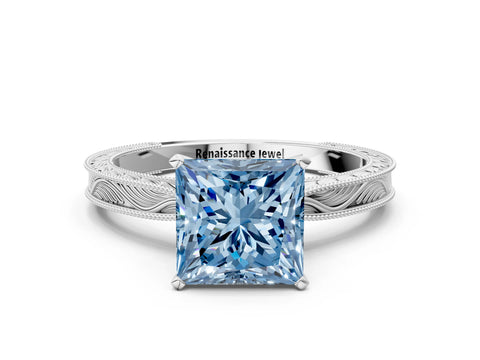 White gold Fancy Blue Princess Cut Solitaire Milgrain Engraved Band with Four-Prong Setting