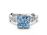 White gold Fancy Blue Princess  Solitaire Twist Band with Leaf Prong Setting