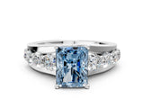 White gold Fancy Blue Radiant  Brilliant Solitaire with Side Stones on a Pave Band and Four-Prong Setting_60