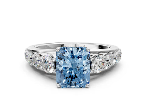 White gold Fancy Blue Radiant Cut Brilliant Diamond Pavé Band with Six-Prong Setting