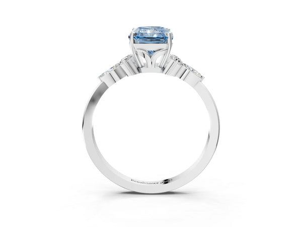 White gold Fancy Blue Radiant Cut Brilliant Diamond Solitaire Ring with Pear Side Stones and Four-Prong Setting