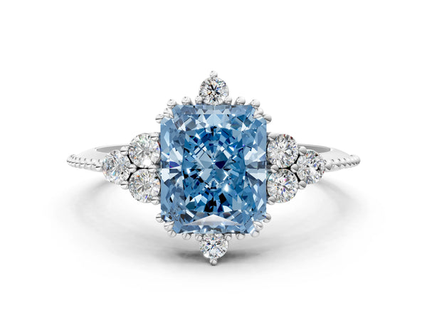 Platinum Fancy Blue Radiant Cut Brilliant Diamond with Cluster Setting on a Beaded Band and Four-Prong Setting