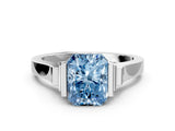 White gold Fancy Blue Radiant Cut Brilliant Solitaire Diamond Ring with Channel Set Band and Bar Prong Setting