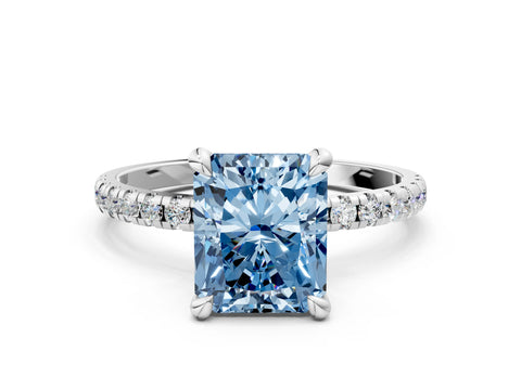 White gold Fancy Blue Radiant Cut Diamond Brilliant Solitaire Ring with Pavé Band and Four-Prong Setting