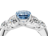 White gold Fancy Blue Radiant  Cut Diamond Cluster Ring with Round Accent Stones and Prong Setting on a Classic Band_71