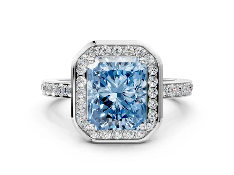 White gold Fancy Blue Radiant Cut Diamond Halo Ring with Bezel Frame and Pavé Band