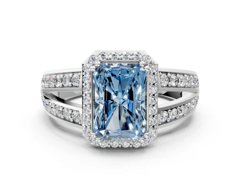 White gold Fancy Blue Radiant Cut Diamond Halo Ring with Split Shank Pavé Band and Four-Prong Setting