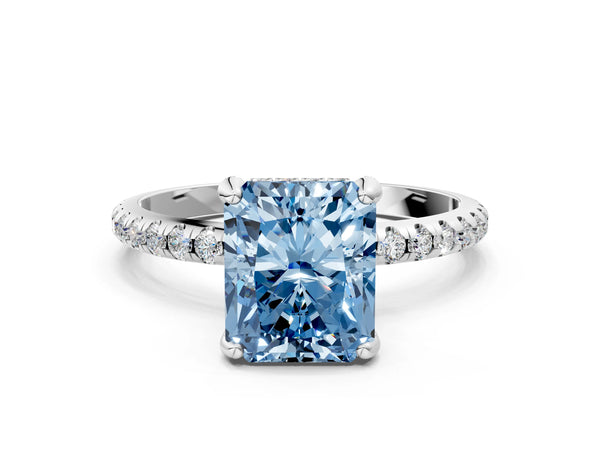 White gold Fancy Blue Radiant Cut Diamond Solitaire Ring with Four-Prong Setting and Pavé Band