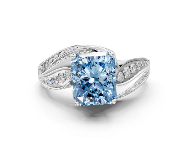 White gold Fancy Blue Radiant Cut Diamond Solitaire Ring with Prong Setting and Twisted Pavé Band