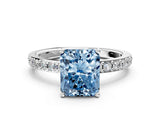 White gold Fancy Blue Radiant  Cut Diamond Solitaire with Pave Band and Four-Prong Setting