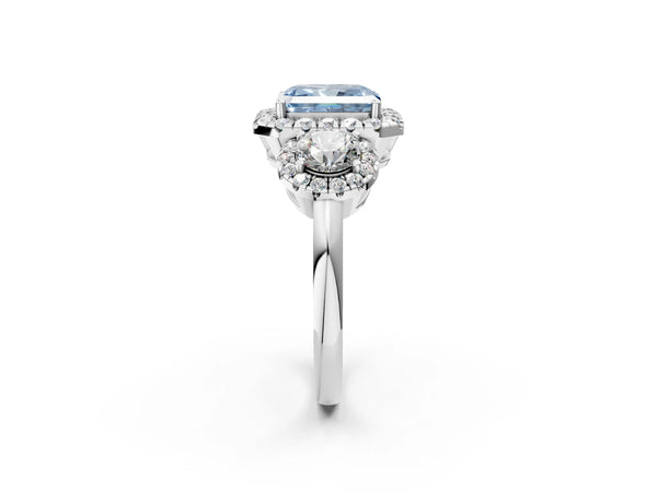 White gold Fancy Blue Radiant Cut Diamond Three-Stone Halo Ring with Prong Setting and Pavé Accents