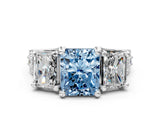 White gold Fancy Blue Radiant Cut Diamond Three-Stone Ring with Channel Set Band and Four-Prong Setting_131