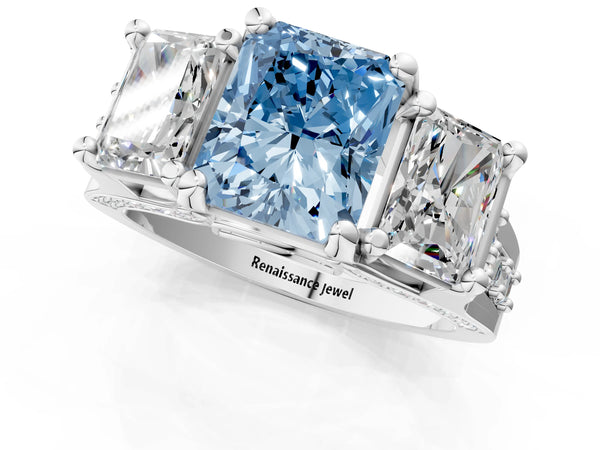 White gold Fancy Blue Radiant Cut Diamond Three-Stone Ring with Channel Set Band and Four-Prong Setting