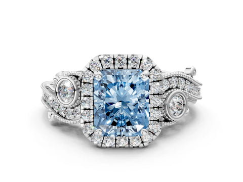 White gold Fancy Blue Radiant Cut Halo Diamond Ring with Milgrain and Bezel Accents on a Split Shank Band