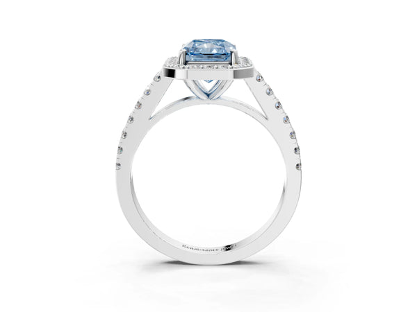Platinum Fancy Blue Radiant Cut Halo Diamond Ring with Pavé Band and Three-Prong Setting