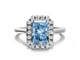 White gold Fancy Blue Radiant Cut Halo Round Diamond Solitaire Ring with Pavé Band and Four-Prong Setting