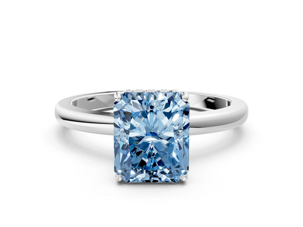 White gold Fancy Blue Radiant Cut Solitaire Diamond Ring with Prong Setting and Plain Band
