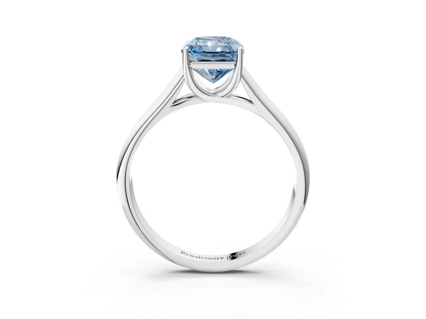 White gold Fancy Blue Radiant Cut Solitaire Engagement Ring with Tapered Band and Four-Prong Setting