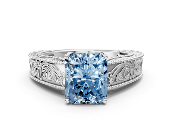 White gold Fancy Blue Radiant Cut Diamond Solitaire Ring with Engraved Band and Four-Prong Setting