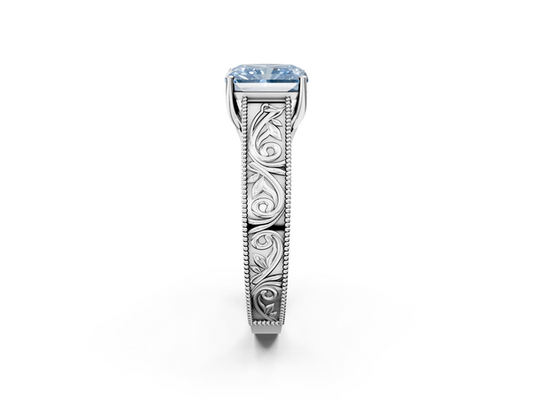White gold Fancy Blue Radiant Cut Diamond Solitaire Ring with Engraved Band and Four-Prong Setting
