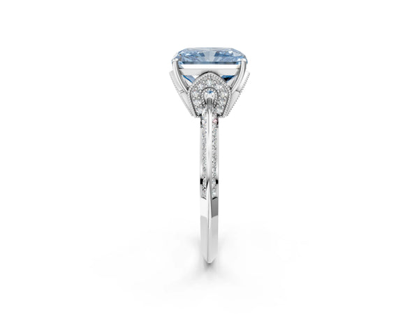 White gold Fancy Blue Radiant Cut Solitaire Split Shank Pave Diamond Engagement Ring with Four-Prong Setting