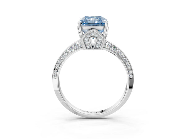 White gold Fancy Blue Radiant Cut Solitaire Split Shank Pave Diamond Engagement Ring with Four-Prong Setting