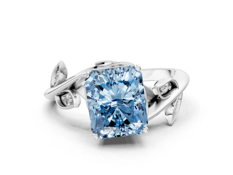 White gold Fancy Blue Radiant Cut Solitaire Twist Engagement Ring with Leaf Accents and Prong Setting_12