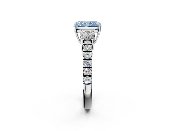White gold Fancy Blue Radiant  Cut Diamond Three-Stone Ring with Round Side Stones and Pavé Band