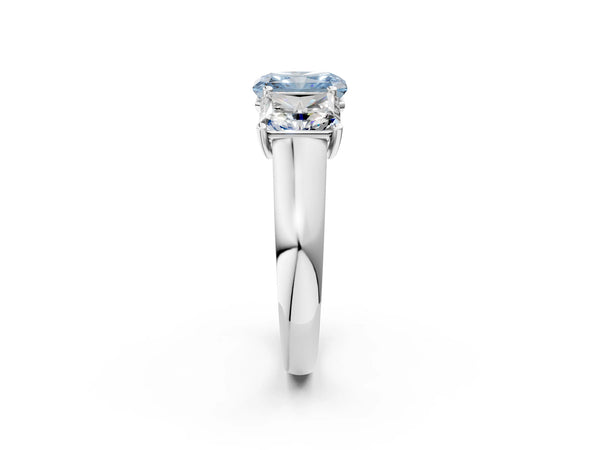 Platinum Fancy Blue Radiant Cut Three-Stone Diamond Ring with Prong Setting on a Classic Band