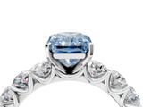 Platinum 5.60 Carat Blue VVS2 Radiant Diamond Prong Setting with Side Stones on a Pave Band