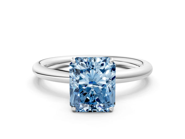White gold Fancy Blue Radiant  Solitaire Diamond Ring with Four-Prong Setting on a Plain Band