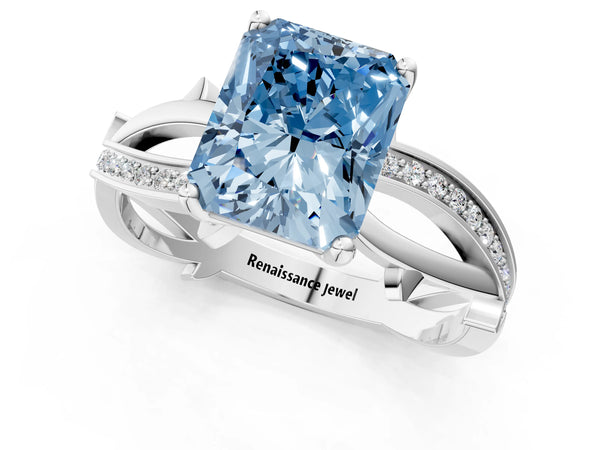 White gold Fancy Blue Radiant  Solitaire Twist Band with Pavé Accents and Four-Prong Setting