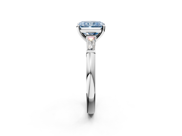 White gold Fancy Blue Radiant  Solitaire with Tapered Baguette Side Stones on a Classic Band with Four-Prong Setting