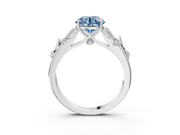 Platinum Fancy Blue Round Cut Diamond Solitaire Ring with Leaf Motif Band and Four-Prong Setting