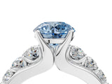 White gold Fancy Blue Round  Brilliant Solitaire with Side Stones on a Pave Band and Four-Prong Setting_179
