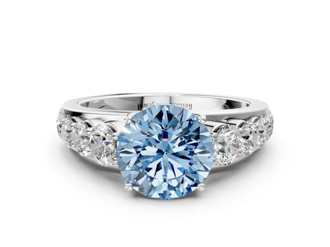 White gold Fancy Blue Round Cut Brilliant Diamond Pavé Band with Six-Prong Setting