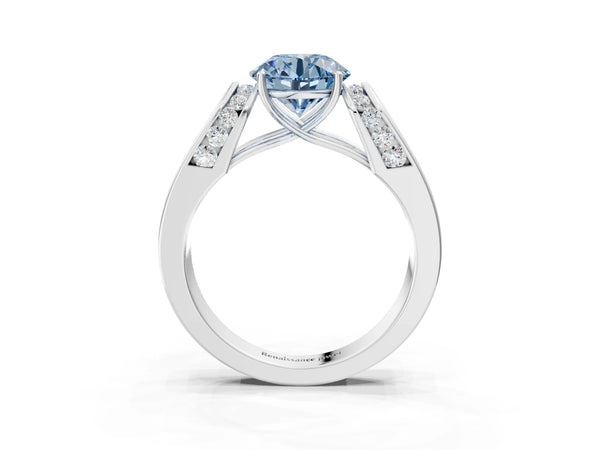 White gold Fancy Blue Round Cut Cut Diamond Channel Set Solitaire Ring with Four-Prong Setting