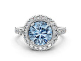 White gold Fancy Blue Round Cut Diamond Halo Ring with Pavé Band and Prong Setting