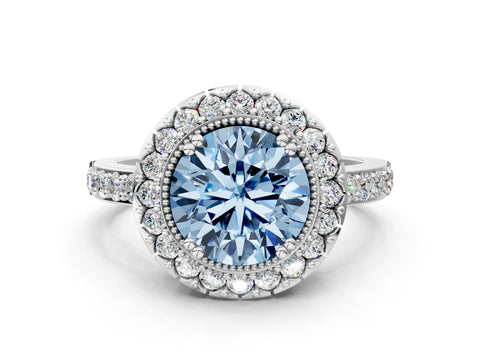 White gold Fancy Blue Round Cut Diamond Halo Ring with Pavé Band and Prong Setting