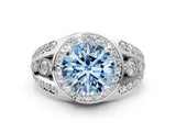 White gold Fancy Blue Round Cut Diamond Halo Ring with Split Shank and Bezel Accents and Four-Prong Setting