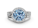 White gold Fancy Blue Round Cut Diamond Halo Ring with Split Shank and Bezel Accents and Prong Setting