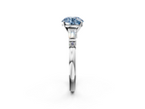White gold Fancy Blue Round  Cut Diamond Ring with Baguette Side Stones, Channel Set Band, and Four-Prong Setting_5