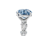 White gold Fancy Blue Round Cut Diamond Side Stone Solitaire Ring with Round  and Four-Prong Setting_138