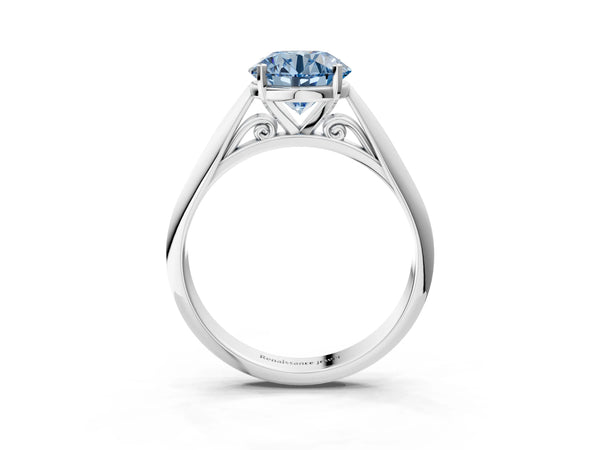 White gold Fancy Blue Round Cut Diamond Solitaire Engagement Ring with Cathedral Setting and Four-Prong Mount