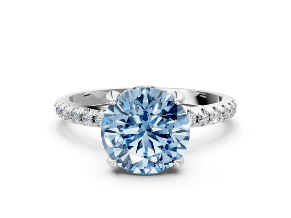 White gold Fancy Blue Round Cut Diamond Solitaire Ring with Four-Prong Setting and Pavé Band