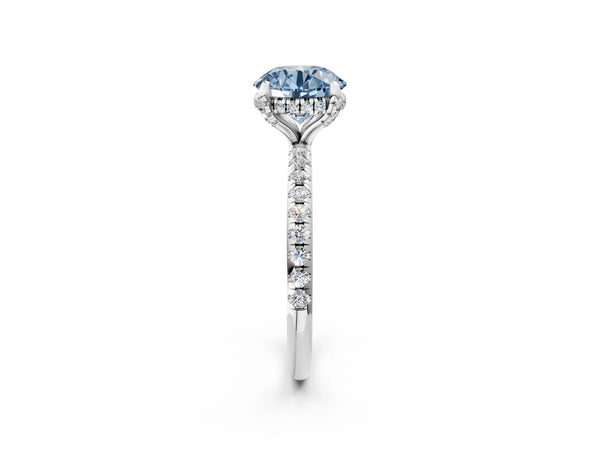 White gold Fancy Blue Round Cut Diamond Solitaire Ring with Four-Prong Setting and Pavé Band